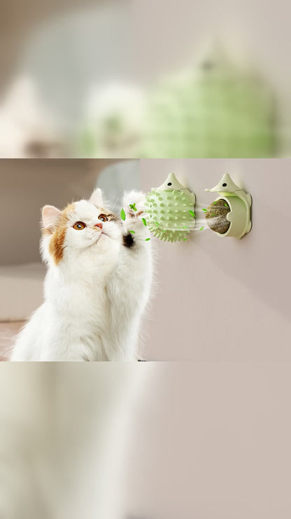 Hedgehog-shaped cat self-groomer mounted flush to a wall with a cat cheek-rubbing the soft spikes, shown in green, blue, and coffee with the silvervine ball.